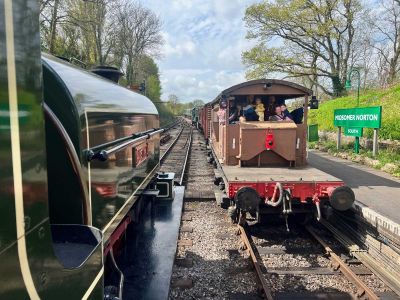 Families enjoying a brake van ride during 