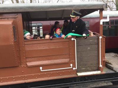 Welton School mini engineers riding in the Queen Mary brake van